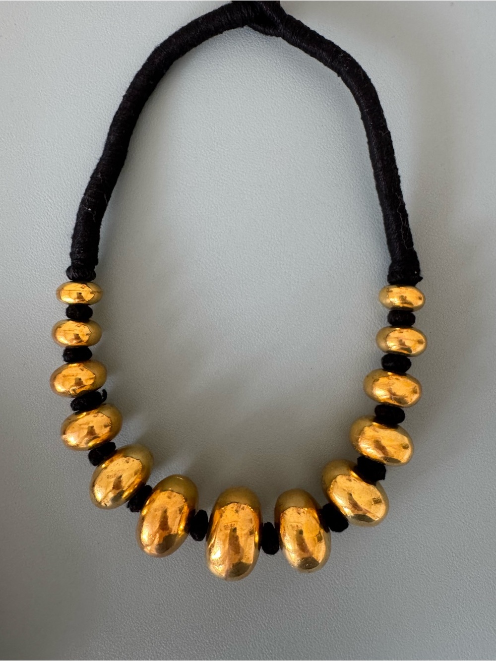 Gold Bead Necklace on Black Cord